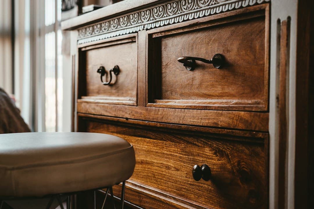 A brown wooden chest of drawers
