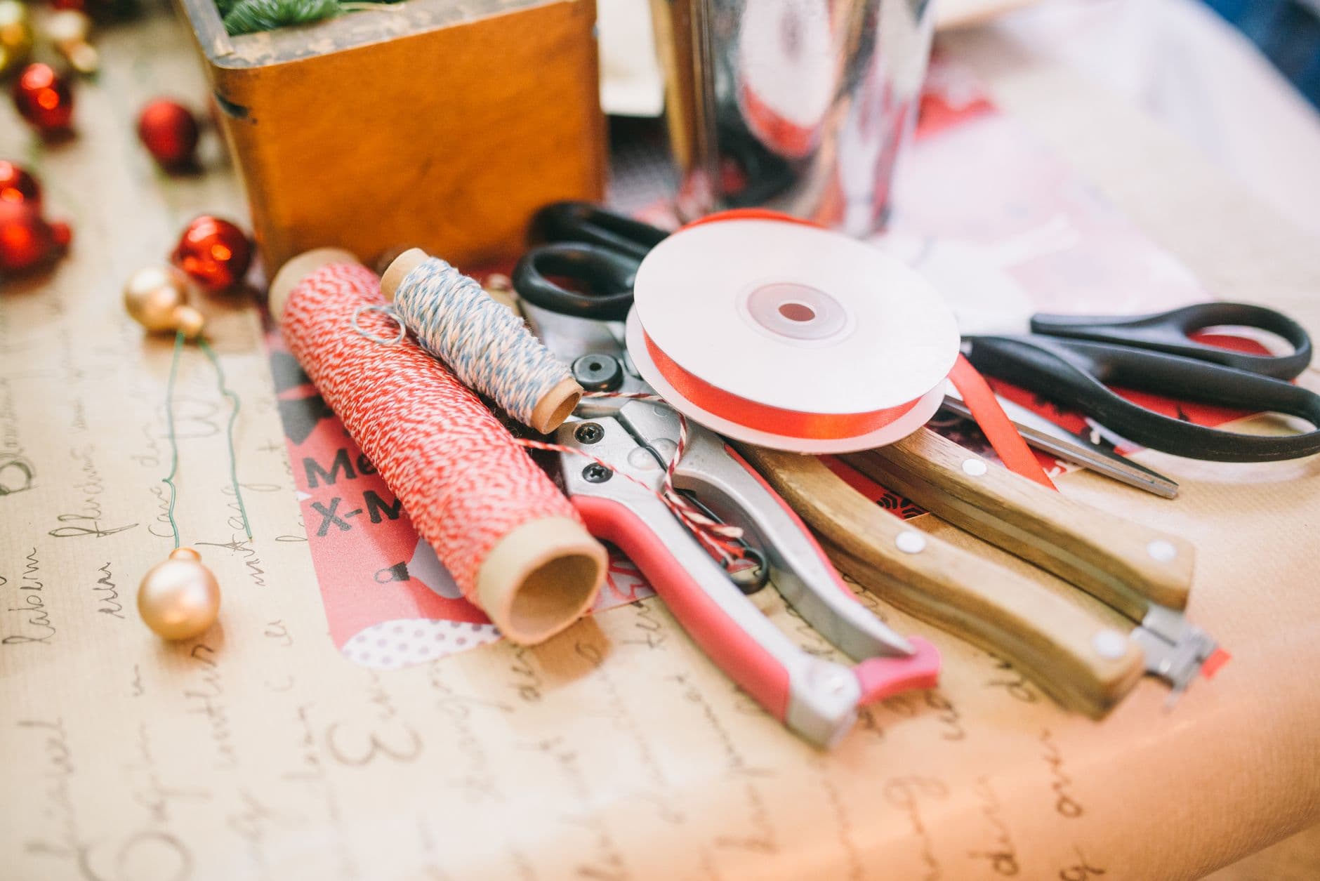 Crafting supplies and tools on a table for festive DIY projects