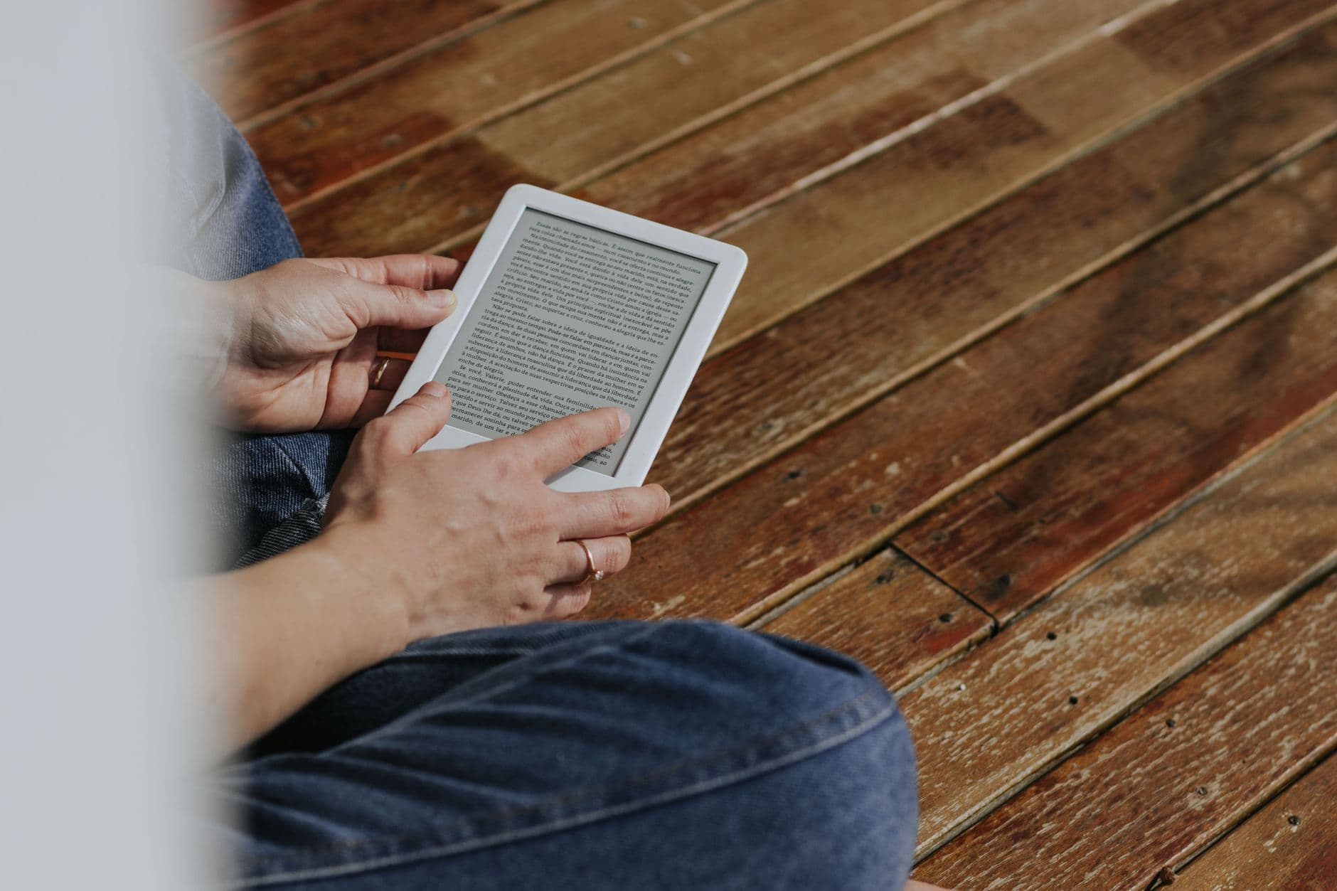 Hands holding an e-reader