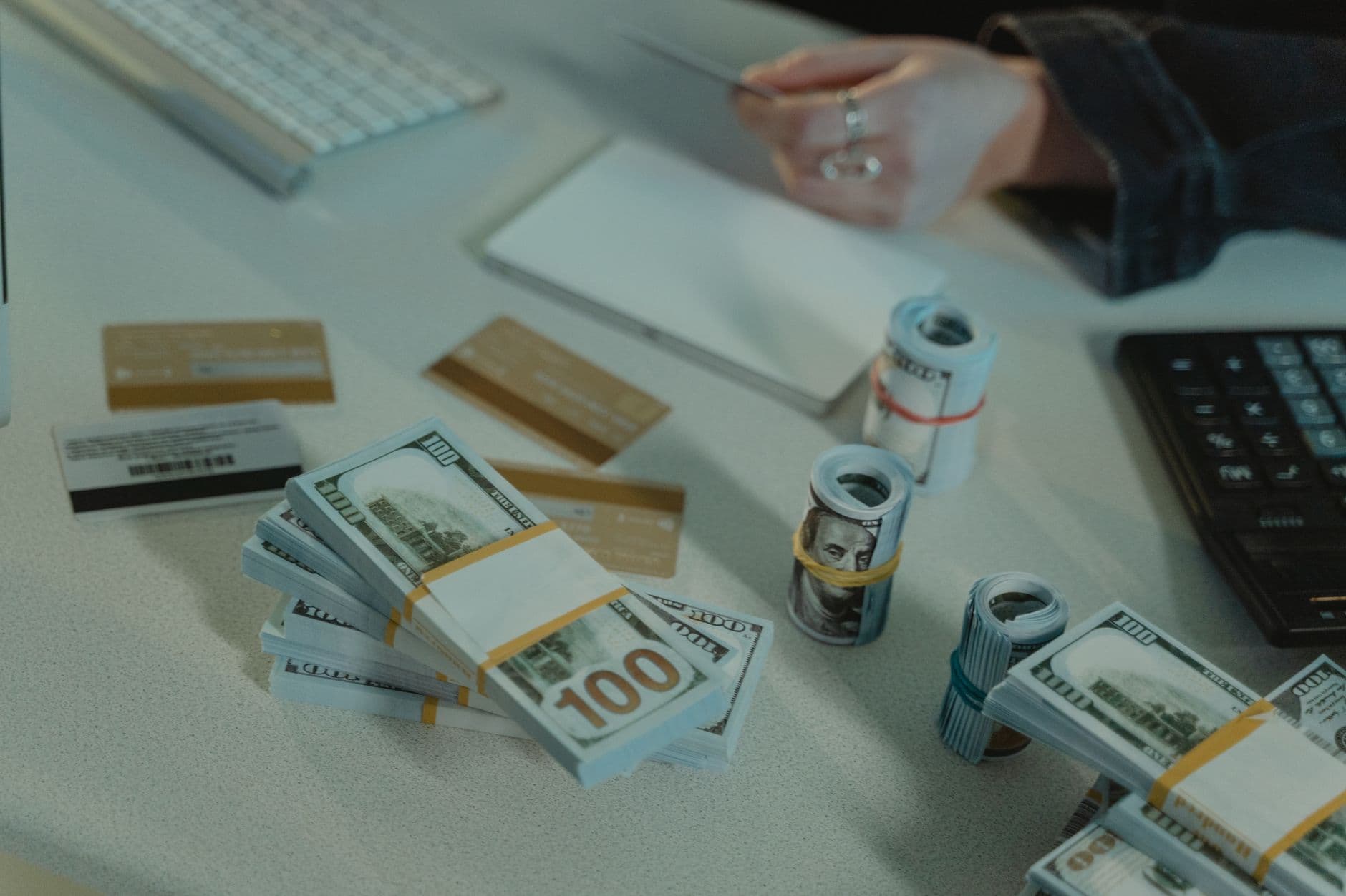 Dollar bills and credit cards on a desk