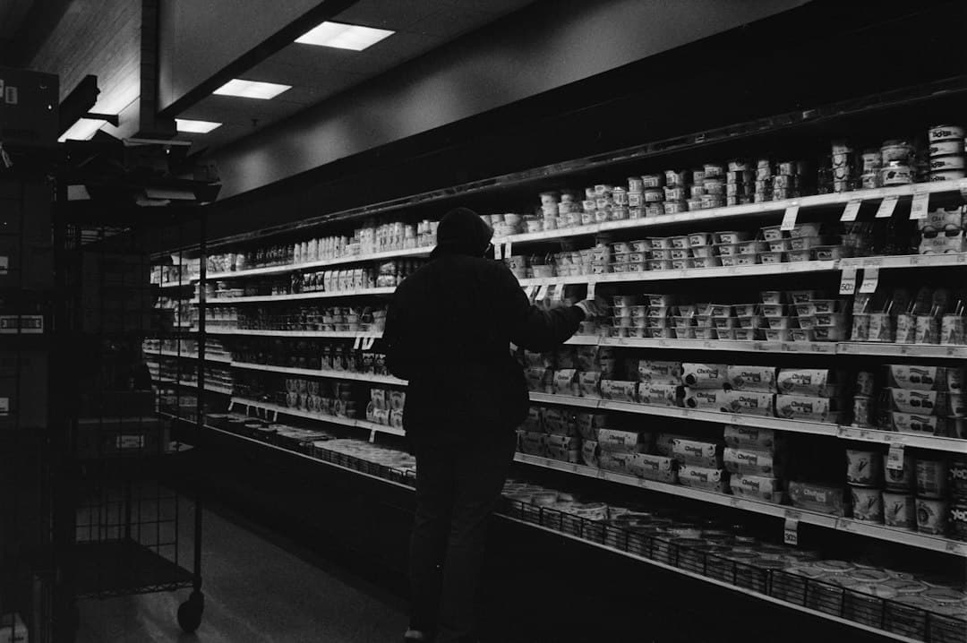 A shopping cart in a grocery store aisle