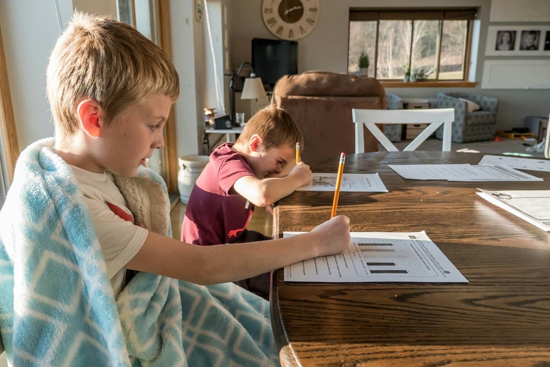 A boy reading a book while studying