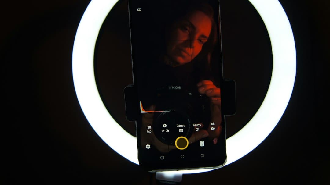 A phone set up in front of a ring light for recording video