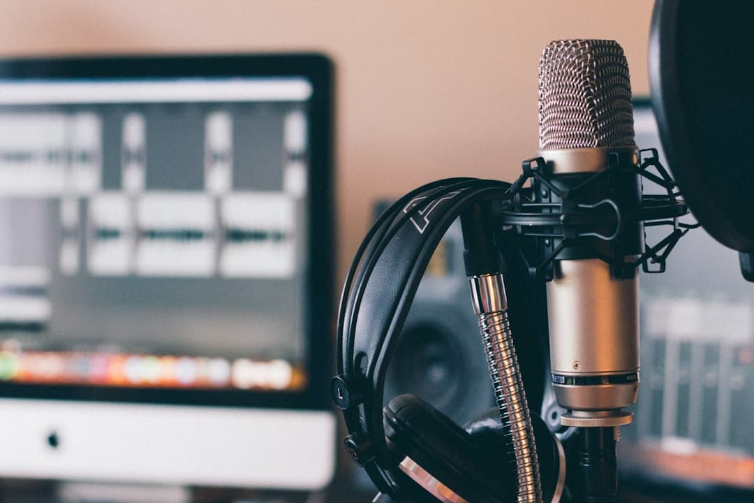 Headphones resting on a studio microphone