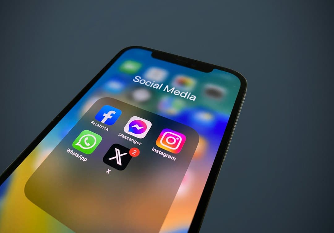 A close-up of a phone with social media icons