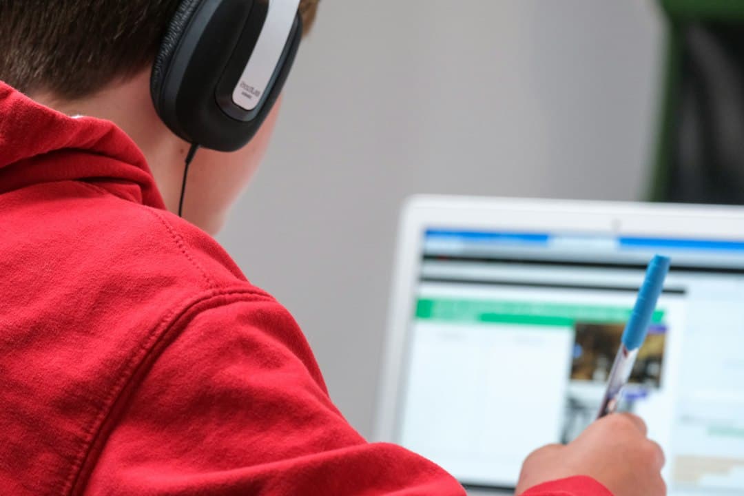 A person wearing headphones on a video call